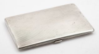 A George V silver cigarette case by William Neale & Son, Birmingham 1931, of rectangular form,