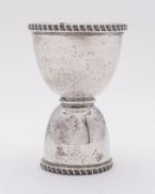 A George V silver double spirit measure/ jigger by Goldsmiths & Silversmiths Co Ltd, London 1911,