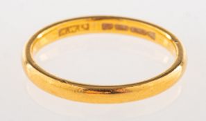 A 22ct gold wedding band, UK hallmark, size K, 2.5grams.