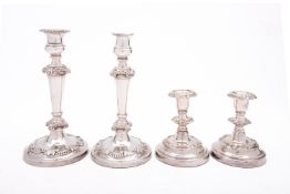 A pair of 19th century Sheffield plate candlesticks with detachable sconces, gadrooned rims, 23.5cm.