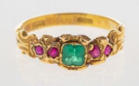 An emerald and ruby ring, an ornate scroll carved ring, possibly Victorian,