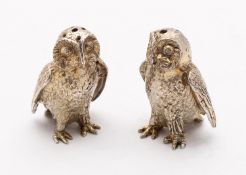 A pair of Elizabeth II cast silver gilt novelty salt and pepper by S.J.L.