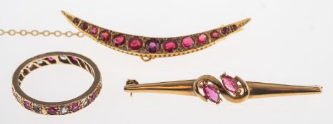 Two brooches and a ring, a crescent moon brooch set with red circular-cut paste stones,