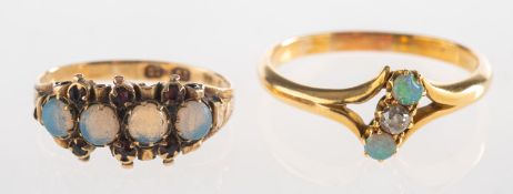 A group of two rings, including a ring set with four moonstone cabochons,