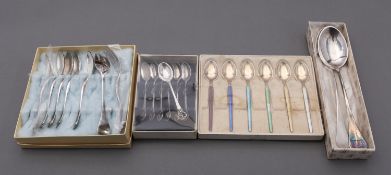 A mixed group of Danish spoons including; seven coffee spoons with pierced handles,