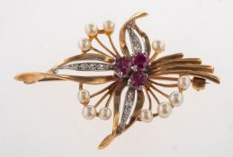 A 1960's 9ct gold ruby, diamond and pearl brooch, a flower spray brooch,
