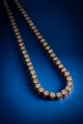 An impressive 18ct gold diamond necklace, claw set with graduated brilliant-cut diamonds,