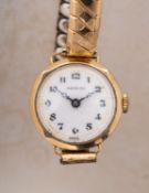 Craftsman a 9ct gold wristwatch the white translucent dial with black Arabic numerals,