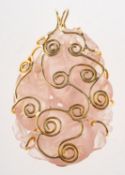 Deakin & Francis. A 1970's 9ct gold carved rose quartz pendant,