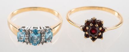 Two 9ct gold gem-set rings, including a 9ct gold cluster ring set with circular-cut garnets,