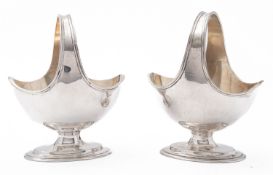 A pair of Edward VII silver salt baskets maker's mark rubbed, London 1905, with wavy reeded rim,