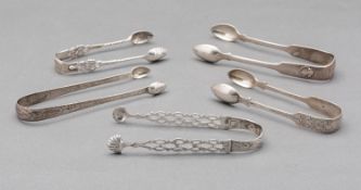 A mixed group of silver sugar tongs including: a pair of Bright cut tongs by Thomas Watson,