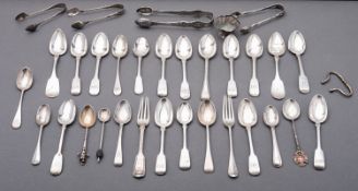 A mixed group of silver spoons; various Fiddle pattern tea spoons and a pair of sugar tongs,