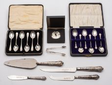 A mixed group of silver including; a cased set of six Elizabeth II tea spoons- retailed by A.