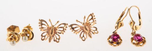 Three pairs of earrings, including a pair of openwork butterfly stud earrings,
