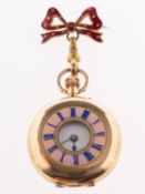 A small 14K gold half-hunter pocket watch the white enamel dial having black Roman numerals and