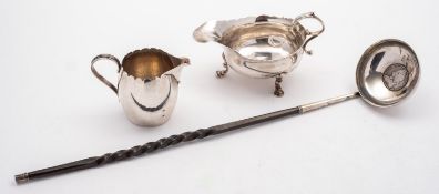 A mixed group of silver including; a George III silver jug by Thomas Chawner, London 1782,