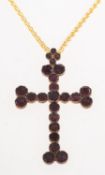 A Victorian garnet set cross pendant and a chain, a cross pendant set with circular-cut garnets,