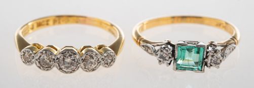 A group of two rings, including a five stone ring,