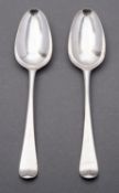 A pair of George III silver Hanoverian pattern shell back table spoons by Thomas Wallis I,