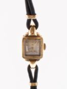 Omega a lady's 18K wristwatch the square silvered dial having round gold plated baton numerals,