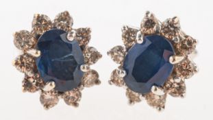 A pair of sapphire and diamond cluster stud earrings,