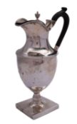 A George V silver hot water jug by Martin, Hall & Co, Sheffield 1911, of urn shape,