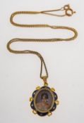 A miniature portrait pendant with chain,