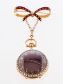 An 18K gold, enamelled, pearl and diamond watch with bow the round convex maroon enamelled dial,
