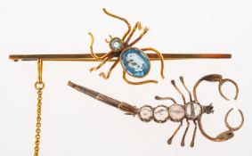 A spider brooch and a scorpion brooch,