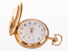 A 14k gold full hunter pocket watch with gold chain the white enamel dial having black Arabic