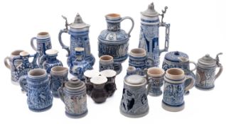 Twenty Westerwald and other similar blue stained stoneware, comprising, ewers,