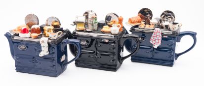 Three Teapottery novelty AGA teapots each modelled with a surface full of kitchenalia,