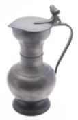 A Dutch pewter flagon and cover with aco