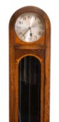 A mid-20th century oak chiming longcase