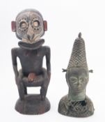 An African carved wood fertility figure