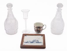 A pair of cut-glass decanters and stoppe