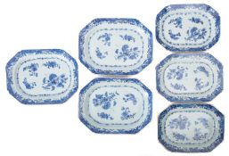 Six Chinese porcelain meat plates of octagonal form painted in blue with scattered blooms within a