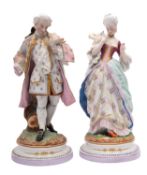 A pair of French coloured bisque porcelain figures,