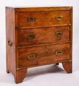 A fruitwood and brass mounted campaign chest of drawers,