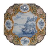 A Samson 'Dutch delft' polychrome wall plaque the centre painted with a cartouche of an estuary and
