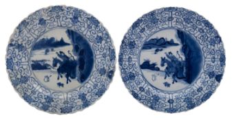 A pair of Chinese blue and white 'hunting' dishes, Kangxi each of lobed form with barbed rim,