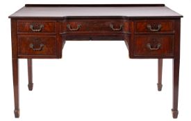 A mahogany inverted breakfront dressing table in Regency style,