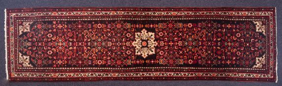 A Malayer runner, the shaded field with all over geometric designs,