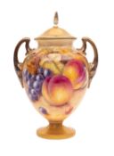A Royal Worcester porcelain two handled vase and cover,