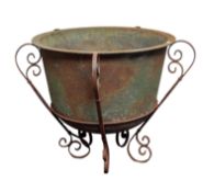 An iron jardiniere and stand, late 19th /early 20th century; of tapering form,