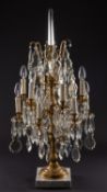 A pair of gilt metal, cut glass and marble mounted twelve light lustre candelabra in Louis XV taste,