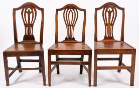 A composed group of six George IIII provincial oak side chairs,