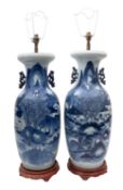 A pair of Chinese blue and white twin handled baluster vases fitted as table lamps,