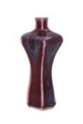 A small Chinese flambé-glazed hexagonal vase of waisted baluster form, 12.5cm.
